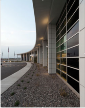 The predetermined location and orientation of the building posed a thermal problem... The solution became the centerpiece of the project's daylight-harvesting strategy. Gray installed a 4,900-sq.-ft SageGlass® electrochromic (electronically tintable) glass wall on the west façade of the office building, which is tied to the building energy management system and automatically tints based on sunlight and measured solar heat gain.